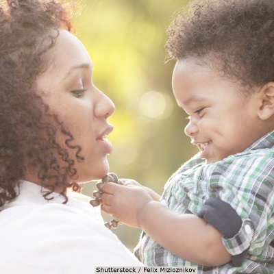 Mother holding her toddler | Shutterstock, Felix Mizioznikov