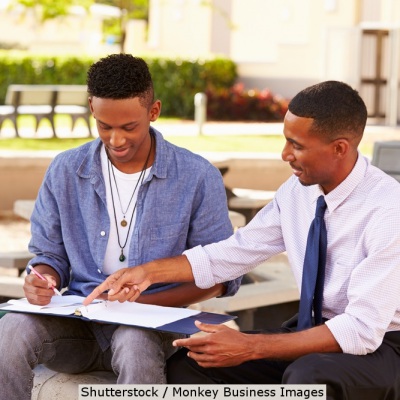 African American student and counselor | Shutterstock, Monkey Business Images