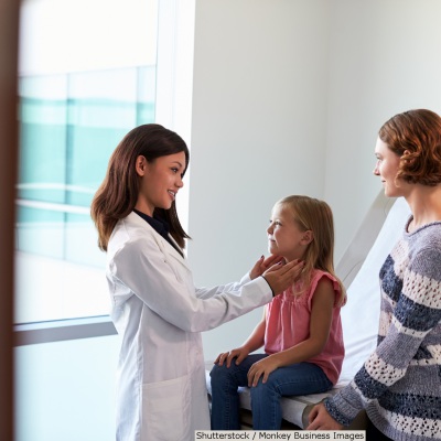 Young child and mom with pediatrician | Shutterstock, Monkey Business Images