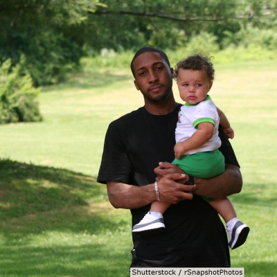 Father holding toddler | Shutterstock, rSnapshotPhotos