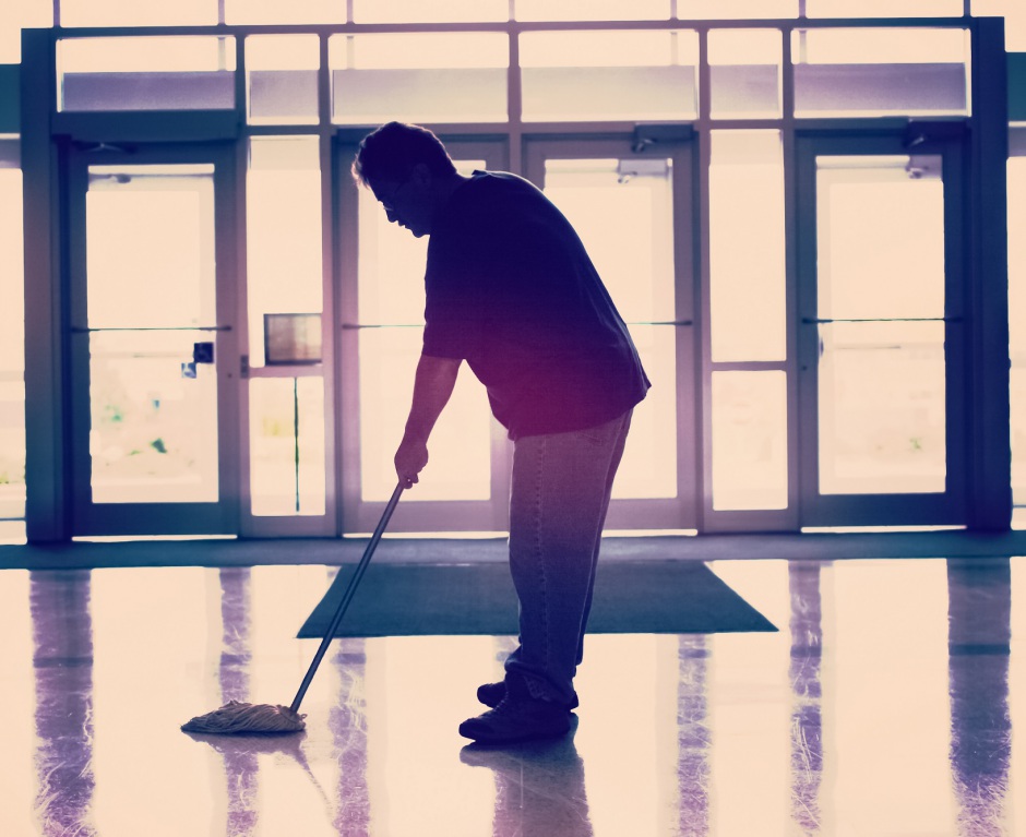 worker mopping floor | Shutterstock, Suzanne Tucker